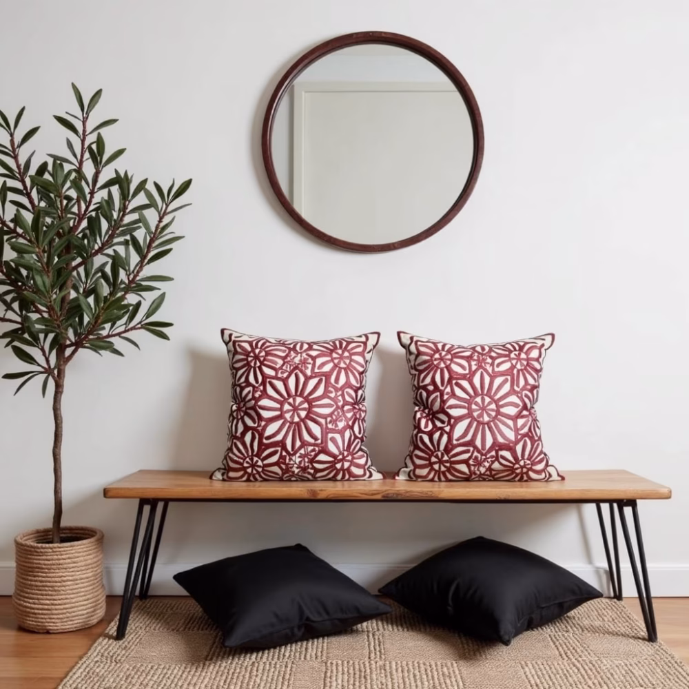Set of embroidered red cushions with minimalist decor