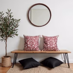Set of embroidered red cushions with minimalist decor