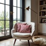 Red floral pillow covers on cream armchair, handcrafted burgundy flower pattern cushions in modern living room
