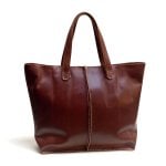 Handcrafted cognac brown leather tote bag with contrast stitching and reinforced base for work and travel
