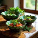 Handcrafted Tamegroute ceramic bowls filled with fresh herbs and cherry tomatoes on rustic wooden board