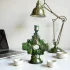 Vintage ceramic candle holder with emerald green Tamegroute glaze and ornate cross design on desk