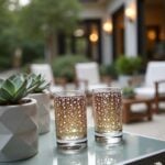 Pair of gold pattern tea glasses with champagne ombré and Mashrabiya pattern on an outdoor glass table