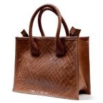 Woven leather tote bag with basketweave pattern and braided handles in cognac brown, structured handcrafted design