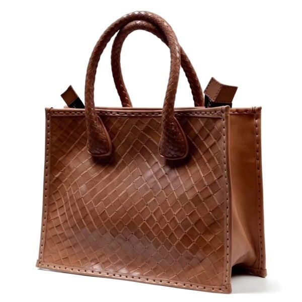Woven leather tote bag with basketweave pattern and braided handles in cognac brown, structured handcrafted design