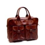 Brown leather laptop messenger bag with brass buckle pockets and contrast stitching on white background