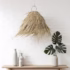 Palm leaf light shade with tropical leaves on white background