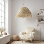 Handwoven palm leaf pendant light with fluffy natural fibers complementing textured chair in bright room
