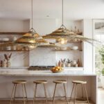 Handcrafted palm leaf pendant light with layered woven structure and organic fringe detail on white brick wall