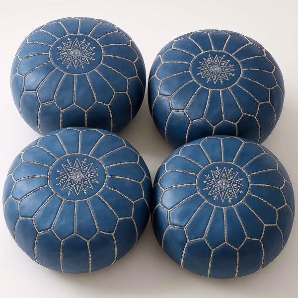 Quartet of sapphire-blue hand-made pouffe ottoman seats with detailed white seams.