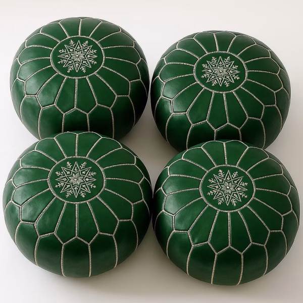 Set of four rich-green Moroccan leather pouffe ottoman seats showing intricate snow-star top stitching.