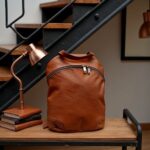 Brown leather backpack purse detail shot showing reinforced corners and handcrafted leather stitching