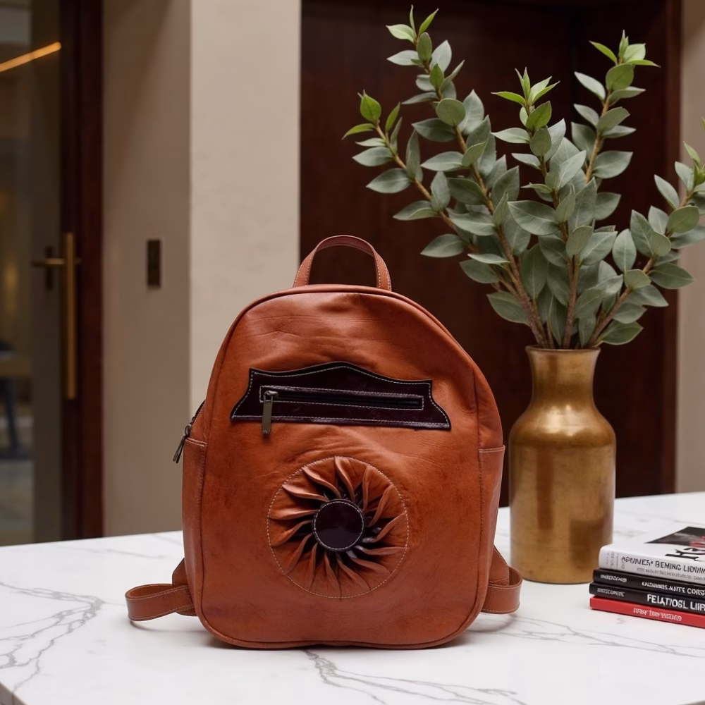 Artisanal leather backpack styled with plants