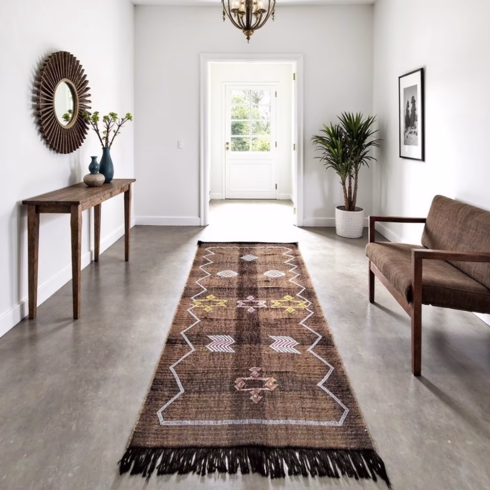 Brown cactus silk runner rug with diamond patterns displayed in modern dining room with wooden furniture