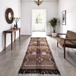 Brown cactus silk runner rug with diamond patterns displayed in modern dining room with wooden furniture