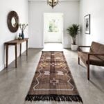 Brown cactus silk runner rug with tribal Berber motifs in an entryway with console table