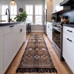 Moroccan cactus silk runner rug positioned in contemporary kitchen with white cabinets and natural lighting