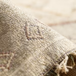 Close-up detail of gray cactus rug showing hand-knotted cactus silk texture and geometric motifs