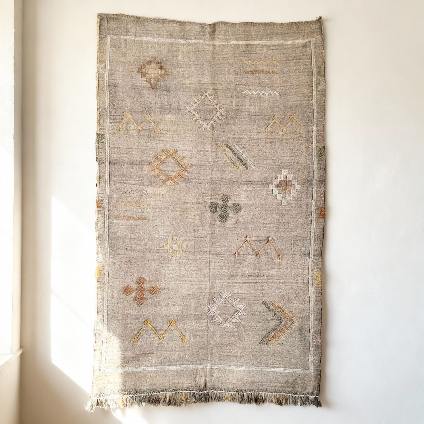 Handmade Moroccan Cactus Rug – Gray Handmade gray Moroccan cactus rug with colorful geometric patterns and sabra silk texture on white background