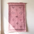 Handwoven moroccan sabra rug wall hanging showing traditional pink cactus silk with border design
