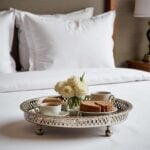 Hand hammered silver circle tray with pierced ajouré rim and polished ball feet