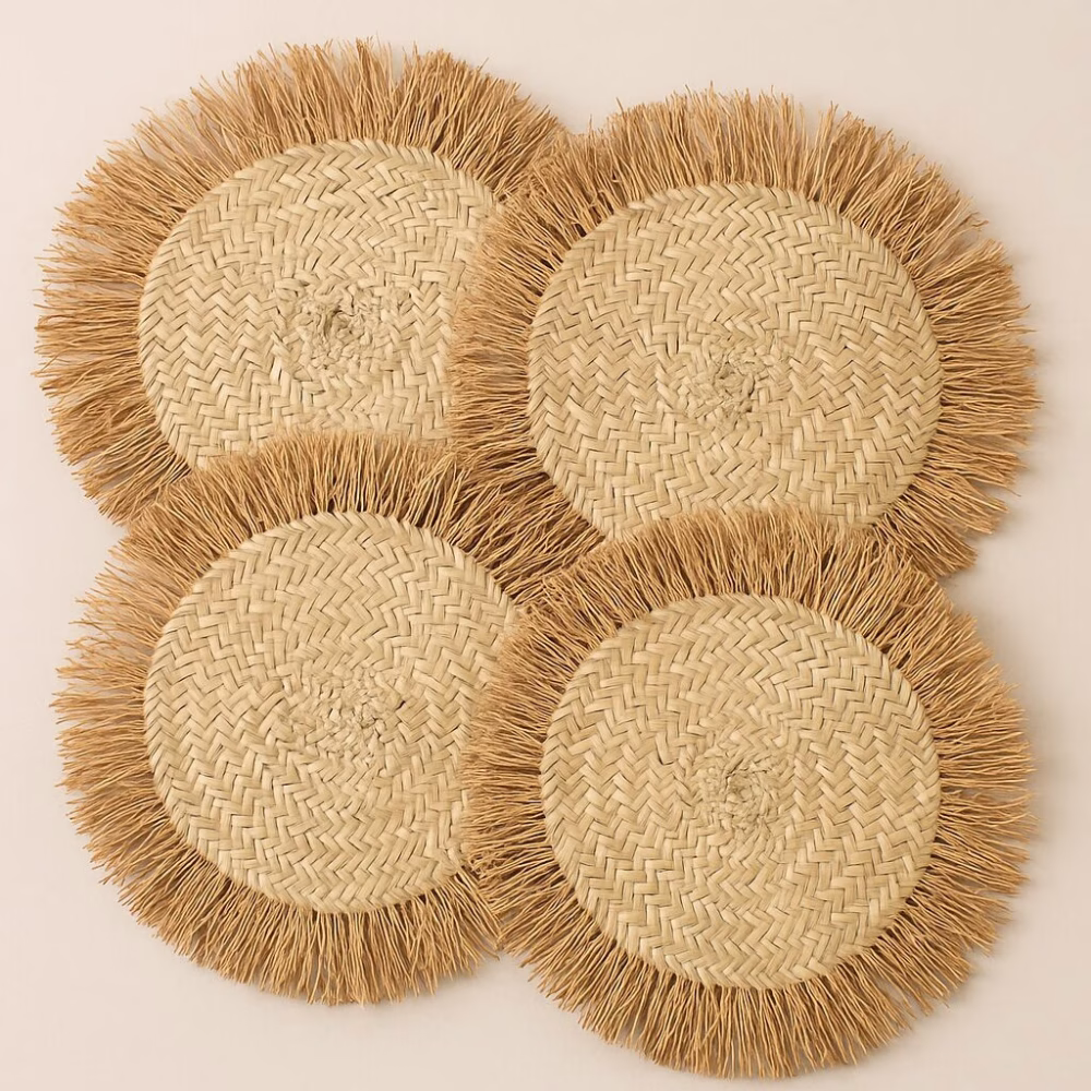 Close-up of the detailed fringe and straw weave of a Moroccan round placemat
