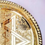 Hand-engraved round platter trays with a Star of David pattern, handmade in Morocco.