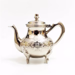 Premium stainless steel Moroccan teapot with engraved designs on white background