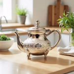 Traditional stainless steel Moroccan teapot on bright wooden table with natural lighting