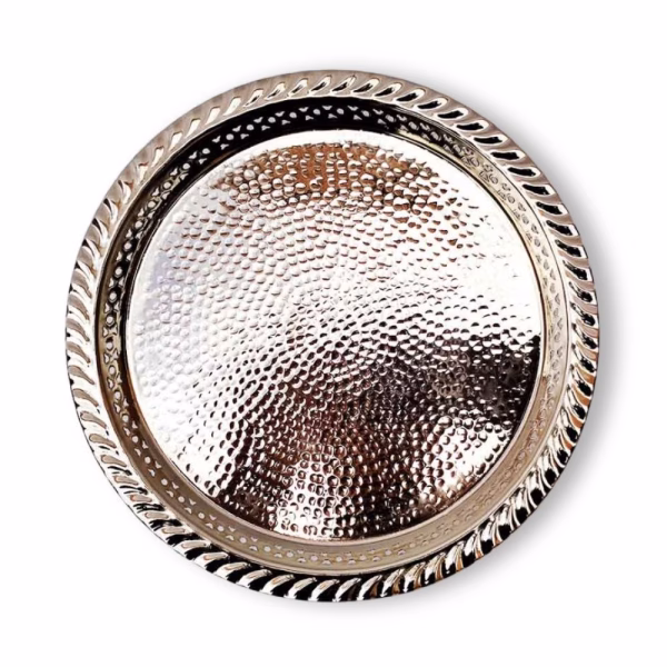 Overhead view of hand hammered silver circle tray showing detailed texture and rope edge design