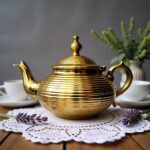 Gold-plated globe body ribbed silver teapot contemporary with horizontal coil design and ornate finial