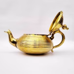 Modern gold-plated teapot with artistic spout design