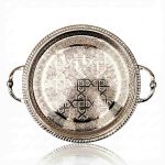 Top view of silver-plated brass serving tray showing geometric star pattern and handles