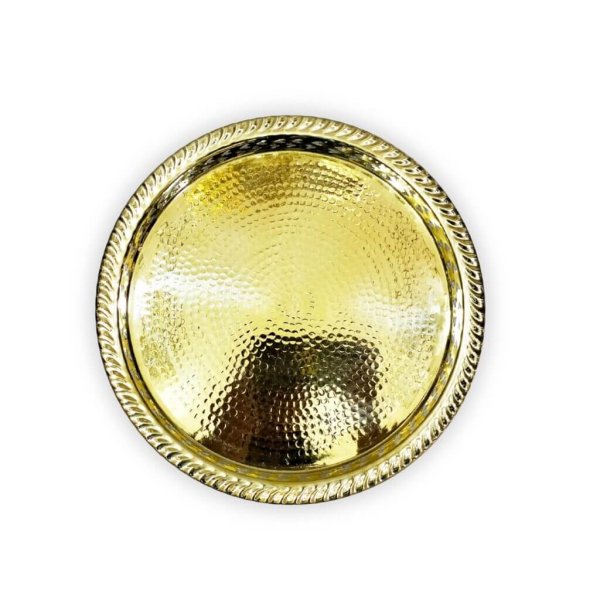 Hand hammered circle tray with ball feet showing textured surface and ornate perforated side detail