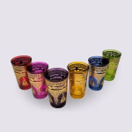 Angled view of colored tea glasses showing henna patterns