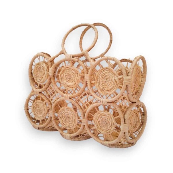 Handwoven raffia tote bag with circular medallion rosettes and arched handles, natural beige raffia