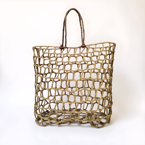 Front view of handwoven mesh straw beach bag showing open weave pattern