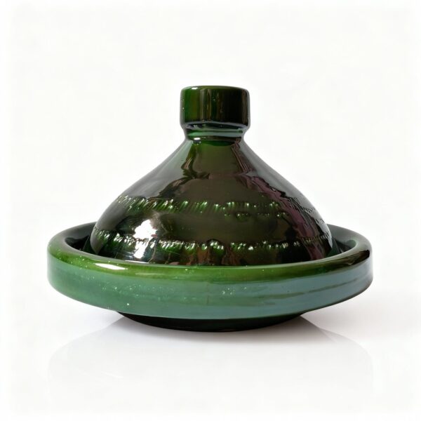 Green ceramic tagine pot with conical lid and flat base, handcrafted Moroccan cookware on white background