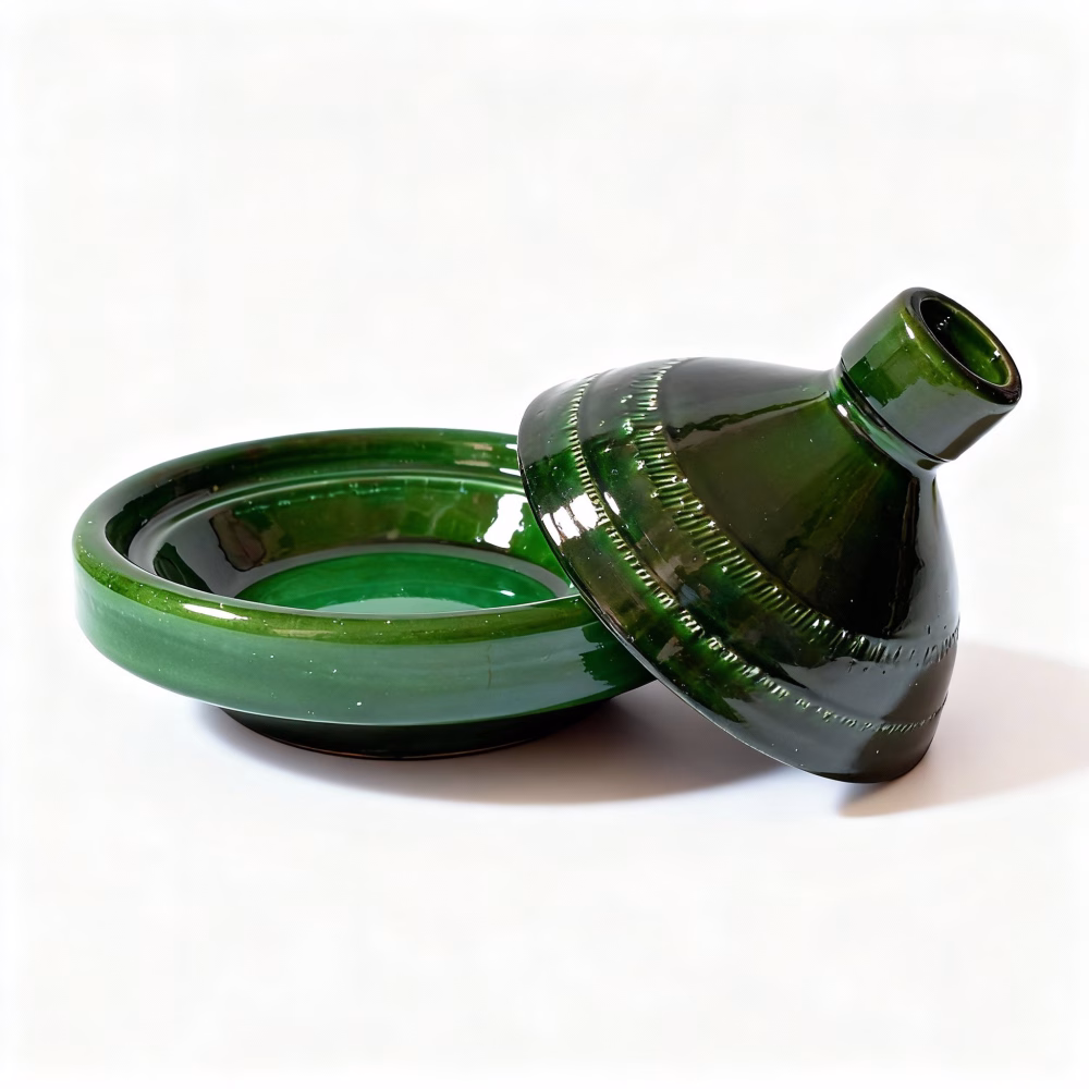 Green ceramic tagine pot separated showing base and conical lid design