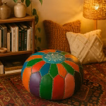 Cozy reading nook featuring a leather pouf ottoman in bright patchwork colors, layered with soft lighting and pillows.