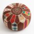 Top view of round leather pouf ottoman with snowflake pattern
