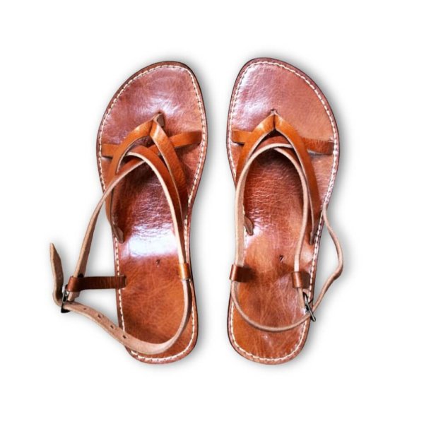 Traditional Moroccan leather sandals in rich tan with cross-strap design and artisan contrast stitching