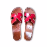 Pink leather artisanal Moroccan flat sandals with cutout pattern