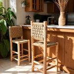 Handwoven bar chair pair with basket-weave palm fiber seats in bright kitchen setting with plants