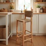 Handwoven bar chair with palm leaf basket-weave backrest and seat in modern farmhouse kitchen interior