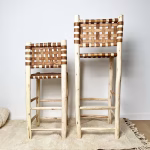 Styled photo of handwoven leather bar stool showing intricate weave pattern