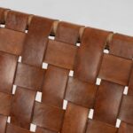 Close-up of basketweave leather detail on lounge chair showing handcrafted vegetable-tanned strips