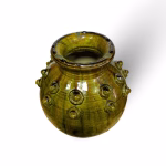Artisanal Tamegroute pottery vase displaying unique glazing variations and handcrafted details