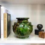 Moroccan ceramic vase 30cm with green glaze displayed on white shelf between books and decorative objects