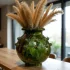 Handmade Tamegroute ceramic vase 30cm with green glaze and decorative studs holding dried pampas grass arrangement